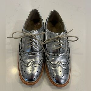 Silver Metallic Oxford loafers.